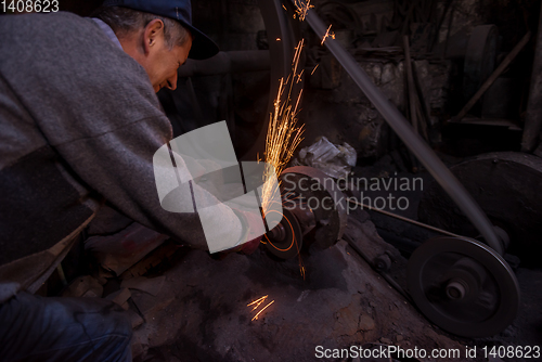 Image of the blacksmith polishing metal products