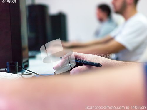 Image of Closeup of Graphic Designer Working at Workplace