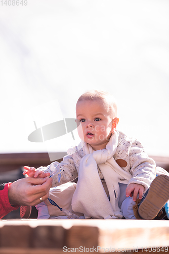 Image of portrait of little baby boy on beautiful winter day