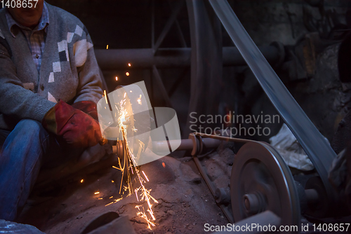 Image of the blacksmith polishing metal products