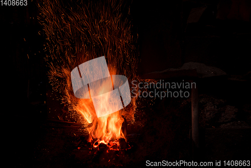 Image of Traditional blacksmith furnace with burning fire