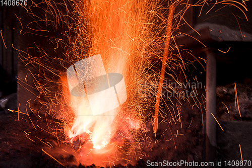 Image of Traditional blacksmith furnace with burning fire