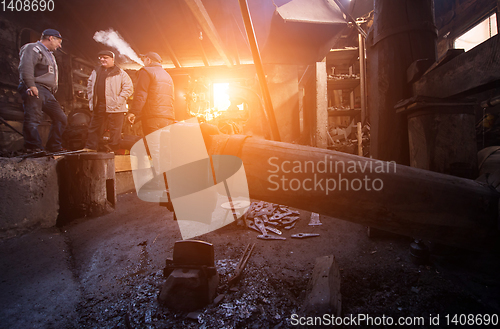 Image of Old mechanical hammer in blacksmith traditional workshop