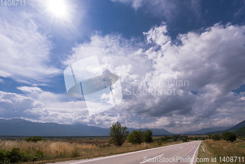 Image of asphalt road in beautiful countryside