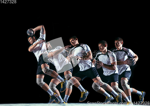 Image of Young handball player against dark studio background in strobe light