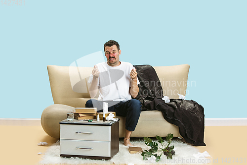 Image of Young man suffering from hausehold dust or seasonal allergy