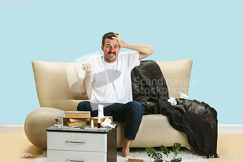 Image of Young man suffering from hausehold dust or seasonal allergy.