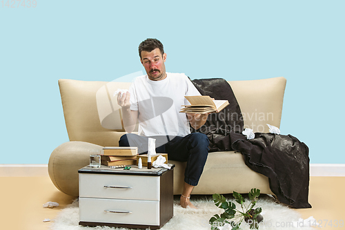 Image of Young man suffering from hausehold dust or seasonal allergy.