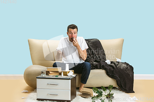 Image of Young man suffering from hausehold dust or seasonal allergy