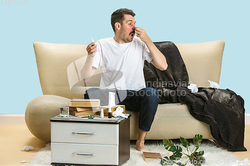 Image of Young man suffering from hausehold dust or seasonal allergy