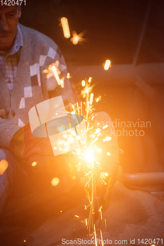 Image of the blacksmith polishing metal products