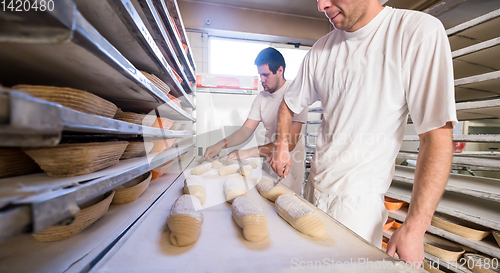 Image of bakers preparing the dough