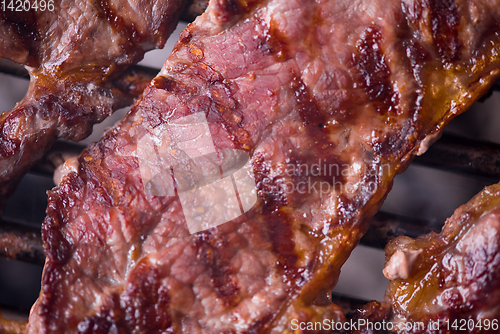 Image of delicious grilled meat on barbecue