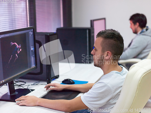 Image of Graphic Designer Working at Workplace