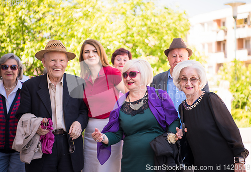 Image of group portrait of senior people with geriatric nurse