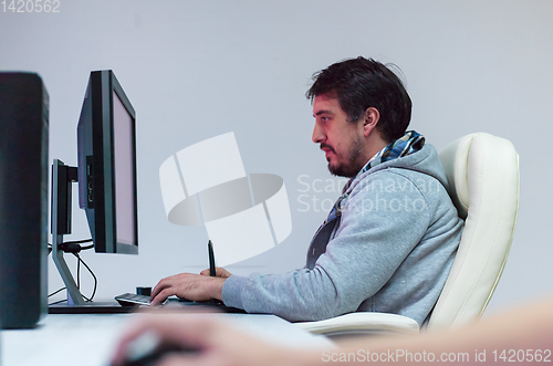 Image of Graphic Designer Working at Workplace