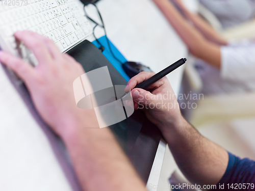 Image of Closeup of Graphic Designer Working at Workplace