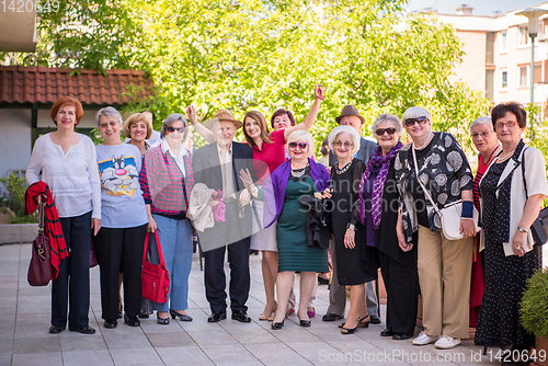 Image of group portrait of senior people with geriatric nurse