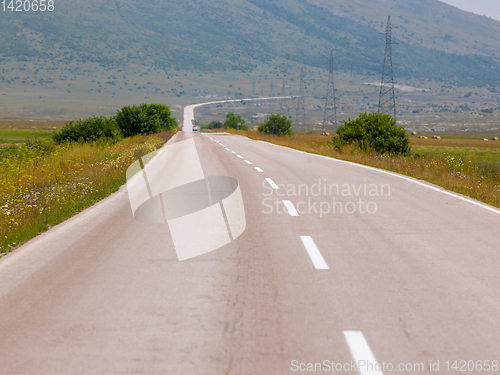 Image of asphalt road in beautiful countryside