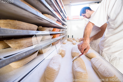 Image of bakers preparing the dough