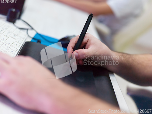 Image of Closeup of Graphic Designer Working at Workplace