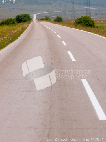 Image of asphalt road in beautiful countryside