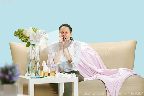 Image of Young woman suffering from hausehold dust or seasonal allergy.