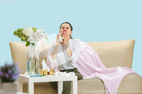 Image of Young woman suffering from hausehold dust or seasonal allergy.