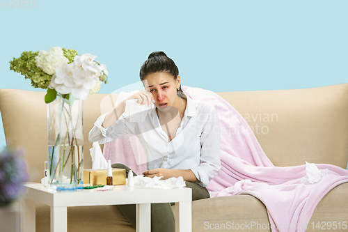 Image of Young woman suffering from hausehold dust or seasonal allergy.