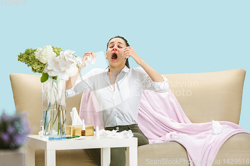 Image of Young woman suffering from hausehold dust or seasonal allergy.