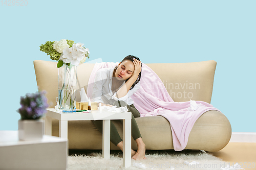 Image of Young woman suffering from hausehold dust or seasonal allergy.