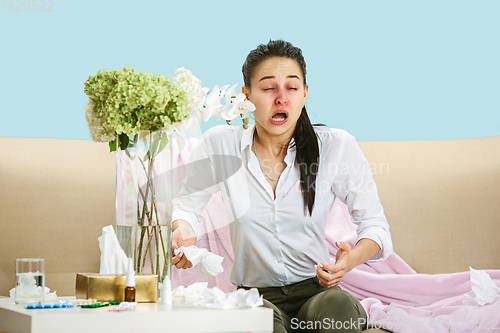 Image of Young woman suffering from hausehold dust or seasonal allergy.
