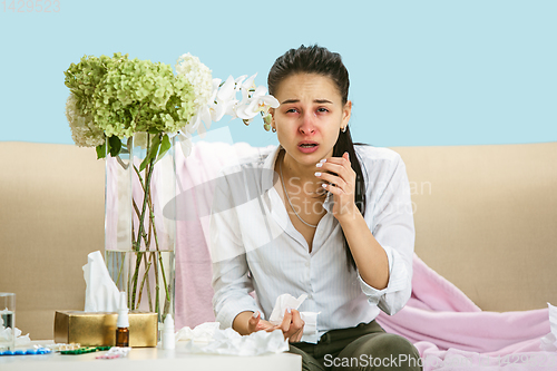 Image of Young woman suffering from hausehold dust or seasonal allergy.