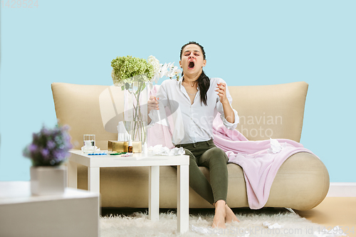 Image of Young woman suffering from hausehold dust or seasonal allergy.