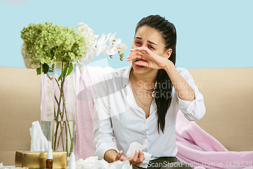 Image of Young woman suffering from hausehold dust or seasonal allergy.