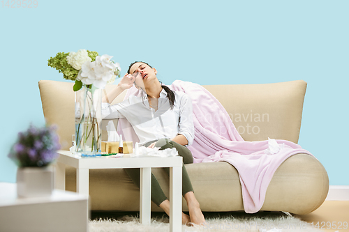 Image of Young woman suffering from hausehold dust or seasonal allergy.