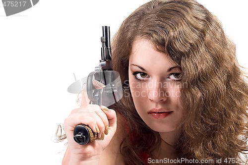 Image of Young woman with a pistol. Isolated on white