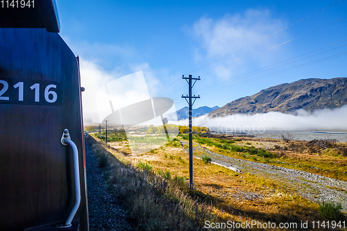 Image of Train in Mountain fields landscape, New Zealand