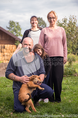 Image of portrait of happy family at farm