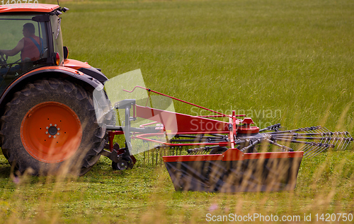 Image of Man driving tractor