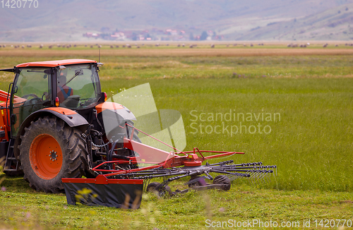 Image of Man driving tractor