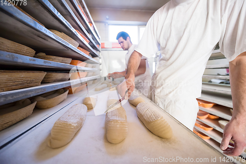 Image of bakers preparing the dough