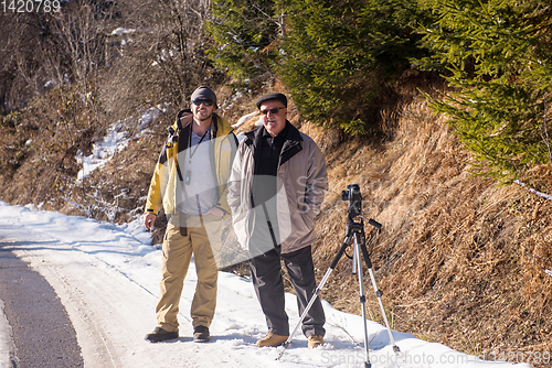 Image of portrait of two male photographer at winter nature