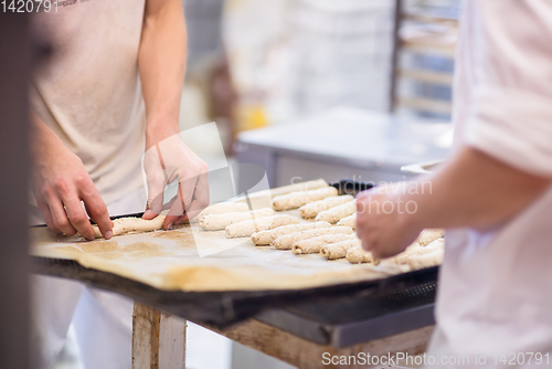 Image of bakers preparing the dough