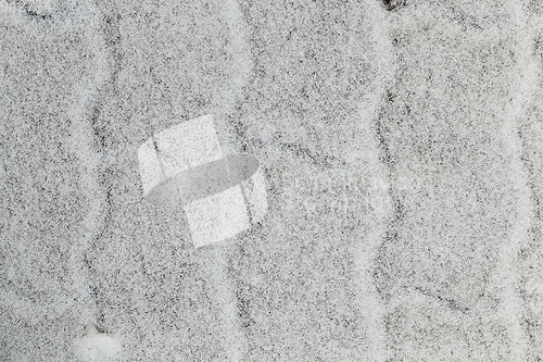 Image of snow-covered sidewalk tile