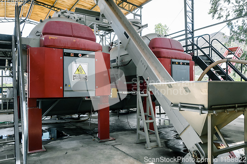 Image of Grape sorter and press in winery