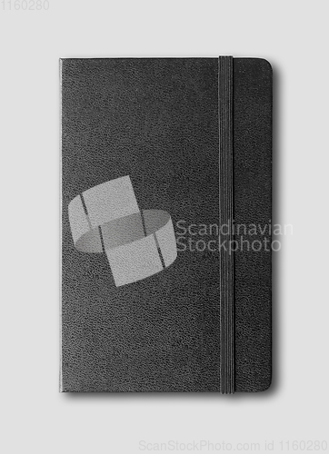 Image of black closed notebook isolated on grey
