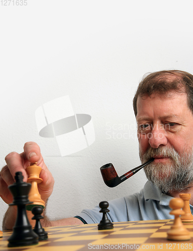 Image of Mature scandinavian man playing chess