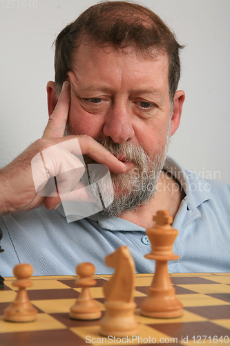 Image of Mature scandinavian man playing chess