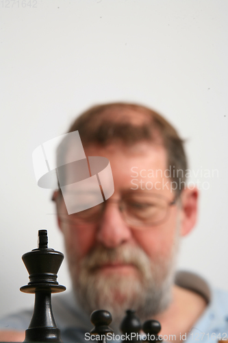 Image of Mature scandinavian man playing chess